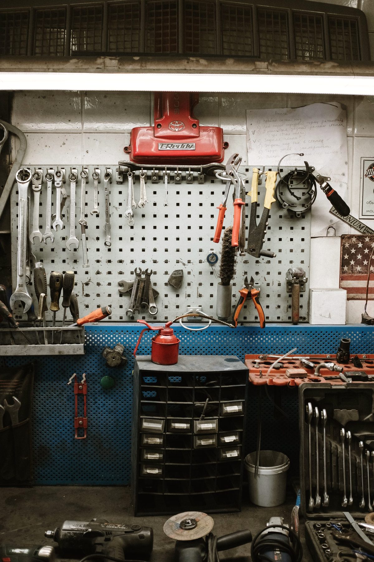 Hand tools hung in order on a workshop pegboard.